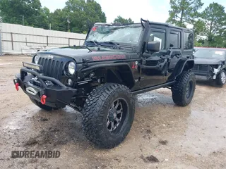 2015 Jeep Wrangler Unlimited Rubicon Hard Rock with VIN 1C4HJWFG0FL674700, listed as a IAAI auction lot 42511949 with 138,370 mi miles and . Bid and sale history available at DreamBid. Image 17.