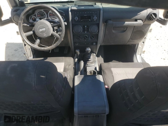 2007 Jeep Wrangler Unlimited Sahara with VIN 1J4GA59147L207482, listed as a Copart auction lot 55666615 with 151,525 mi miles and Salvage title. Bid and sale history available at DreamBid. Image 8.