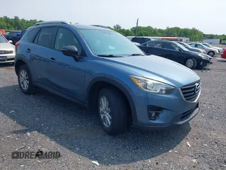 2016 Mazda CX-5 Touring z VIN JM3KE4CYXG0713248, wystawiony jako IAAI lot #42421393 z przebiegiem 102 169 mil mil oraz . Historia ofert i sprzedaży dostępna na DreamBid. Obrazek 1.