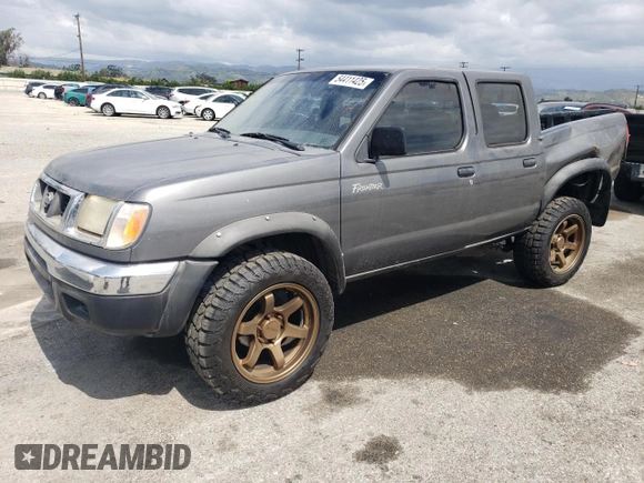 2000 Nissan Frontier XE with VIN 1N6ED27T5YC426456, listed as a Copart auction lot 54411425 with 117,600 mi miles and Salvage title. Bid and sale history available at DreamBid. Image 1.