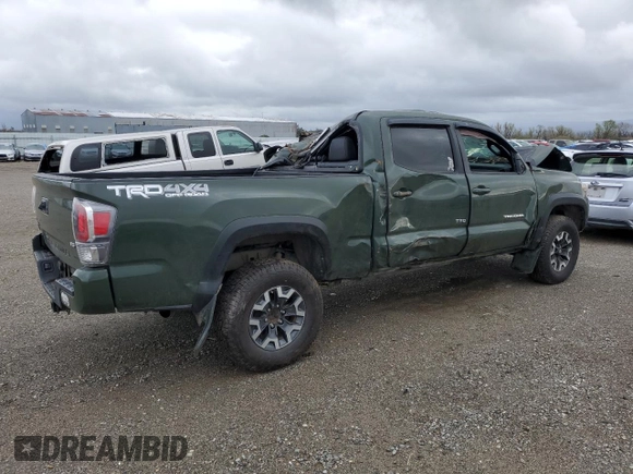 2021 Toyota Tacoma 4WD SR5 with VIN 3TMDZ5BNXMM099474, listed as a Copart auction lot 49325385 with 57,853 mi miles and Salvage Title. Bid and sale history available at carsss.com. Image 3.