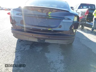 2014 Tesla Model S 60 with VIN 5YJSA1H17EFP33275, listed as a IAAI auction lot 41778167 with 202,749 mi miles and . Bid and sale history available at DreamBid. Image 6.