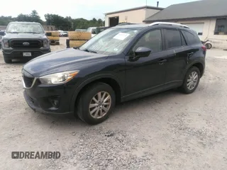 2014 Mazda CX-5 Touring z VIN JM3KE2CYXE0429149, wystawiony jako IAAI lot #42471772 z przebiegiem 222 440 mil mil oraz . Historia ofert i sprzedaży dostępna na DreamBid. Obrazek 2.