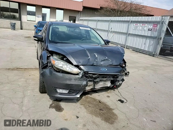 2015 Ford Focus SE z VIN 1FADP3F29FL340350, wystawiony jako Copart lot #53466455 z przebiegiem 146 374 mil mil oraz Szkoda całkowita • Salvage title. Historia ofert i sprzedaży dostępna na DreamBid. Obrazek 11.