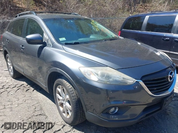 2015 Mazda CX-9 Touring with VIN JM3TB3CV1F0461854, listed as a IAAI auction lot 42068299 with 128,124 mi miles. Bid and sale history available at carsss.com. Image 1.