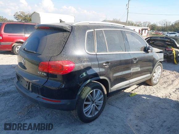 2012 Volkswagen Tiguan SE with VIN WVGAV7AX8CW565863, listed as a IAAI auction lot 41528643 with 122,569 mi miles and . Bid and sale history available at DreamBid. Image 4.