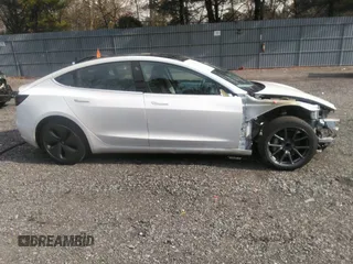 2020 Tesla Model 3 Standard Range Plus with VIN 5YJ3E1EA4LF792830, listed as a IAAI auction lot 41852919 with 76,461 mi miles. Bid and sale history available at carsss.com. Image 13.
