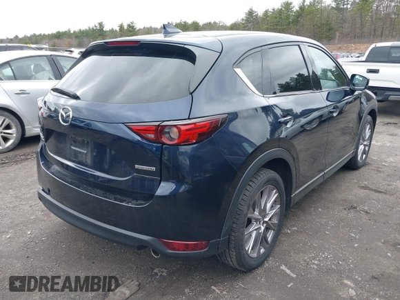 2020 Mazda CX-5 Grand Touring with VIN JM3KFBDM7L1723852, listed as a IAAI auction lot 41848152 with 85,099 mi miles. Bid and sale history available at carsss.com. Image 4.