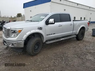 2016 Nissan Titan XD PRO-4X with VIN 1N6BA1F45GN517682, listed as a Copart auction lot 79774674 with 149,675 mi miles and Salvage Title. Bid and sale history available at carsss.com. Image 1.