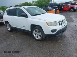 2011 Jeep Compass Latitude with VIN 1J4NT1FB1BD192076, listed as a IAAI auction lot 42121930 with 148,548 mi miles. Bid and sale history available at carsss.com. Image 1.