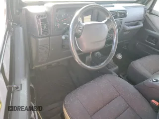 2002 Jeep Wrangler SE with VIN 1J4FA29P22P764181, listed as a Copart auction lot 76469364 with 134,275 mi miles and Salvage Title. Bid and sale history available at DreamBid. Image 8.