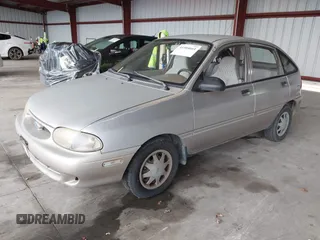 1997 Ford Aspire z VIN KNJLT06H0V6215753, wystawiony jako IAAI lot #41504661 z przebiegiem 80 300 mil mil oraz . Historia ofert i sprzedaży dostępna na DreamBid. Obrazek 2.