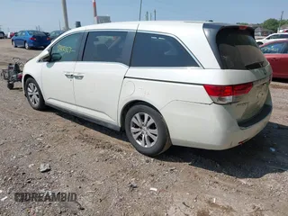 2014 Honda Odyssey EX-L with VIN 5FNRL5H63EB131596, listed as a IAAI auction lot 42402427 with 106,156 mi miles and . Bid and sale history available at DreamBid. Image 3.