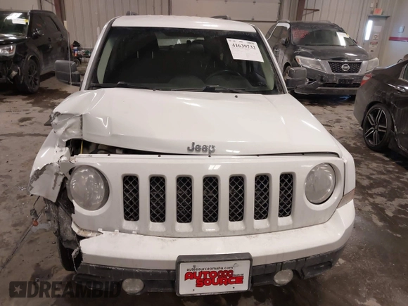 2014 Jeep Patriot Latitude with VIN 1C4NJRFB4ED864114, listed as a IAAI auction lot 41639732 with 103,119 mi miles. Bid and sale history available at carsss.com. Image 12.