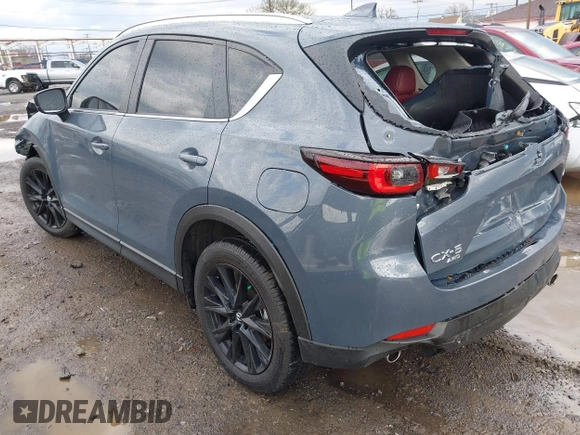 2024 Mazda CX-5 S Carbon Edition z VIN JM3KFBCL1R0470051, wystawiony jako IAAI lot #42088186 z przebiegiem 10 285 mil mil oraz . Historia ofert i sprzedaży dostępna na DreamBid. Obrazek 3.