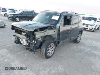 2021 Jeep Renegade Latitude with VIN ZACNJDBB0MPN13884, listed as a IAAI auction lot 40957052 with 52,023 mi miles. Bid and sale history available at carsss.com. Image 2.