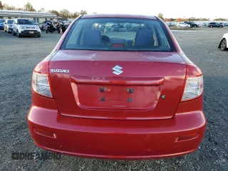 2013 Suzuki SX4 LE with VIN JS2YC5A37D6101819, listed as a Copart auction lot 82367044 with 142,932 mi miles and Salvage Title. Bid and sale history available at carsss.com. Image 6.