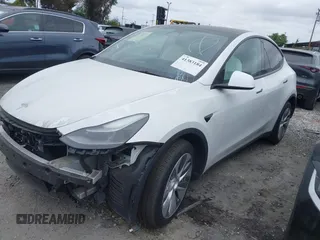 2023 Tesla Model Y Long Range z VIN 7SAYGDEE9PF623285, wystawiony jako IAAI lot #41383184 z przebiegiem 34 092 mil mil oraz . Historia ofert i sprzedaży dostępna na DreamBid. Obrazek 2.