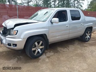 2014 Honda Ridgeline SE with VIN 5FPYK1F62EB013329, listed as a IAAI auction lot 41876728 with 127,014 mi miles. Bid and sale history available at carsss.com. Image 2.
