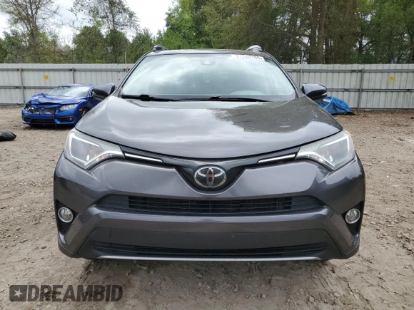 2018 Toyota RAV4 XLE with VIN 2T3WFREV6JW409330, listed as a Copart auction lot 51284165 with 83,689 mi miles and Salvage Title. Bid and sale history available at DreamBid. Image 5.