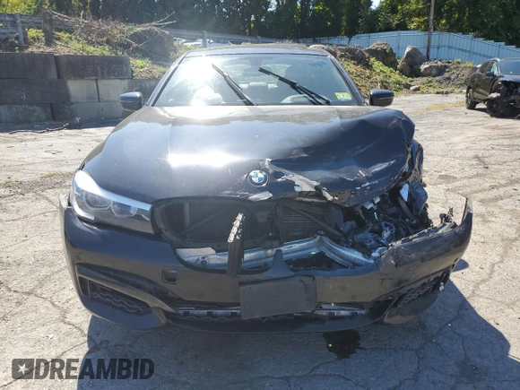 2017 BMW 7 Series 740i xDrive with VIN WBA7E4C54HGU99710, listed as a Copart auction lot 69572544 with 0 mi miles and Salvage Title. Bid and sale history available at carsss.com. Image 5.