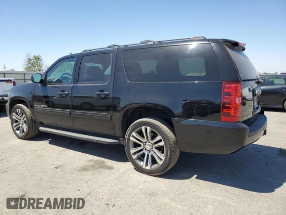 2014 Chevrolet Suburban LS with VIN 1GNSCHE03ER132039, listed as a Copart auction lot 68390234 with 129,744 mi miles and Salvage Title. Bid and sale history available at carsss.com. Image 2.