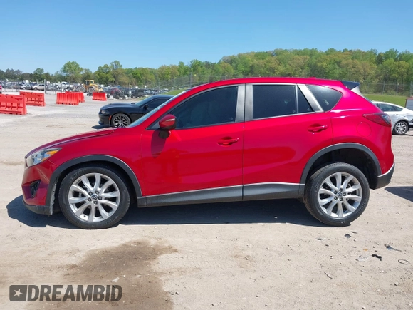 2015 Mazda CX-5 Grand Touring with VIN JM3KE4DY5F0469439, listed as a IAAI auction lot 42053851 with 70,676 mi miles. Bid and sale history available at carsss.com. Image 14.