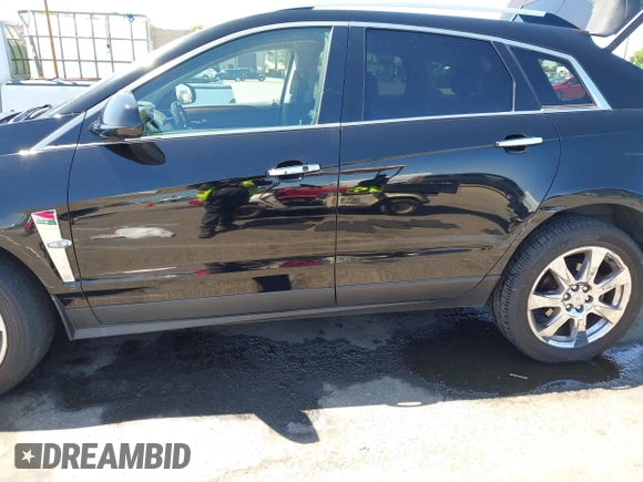 2012 Cadillac SRX Performance Collection z VIN 3GYFNBE30CS659973, wystawiony jako IAAI lot #42555119 z przebiegiem 141 842 mil mil oraz . Historia ofert i sprzedaży dostępna na DreamBid. Obrazek 6.