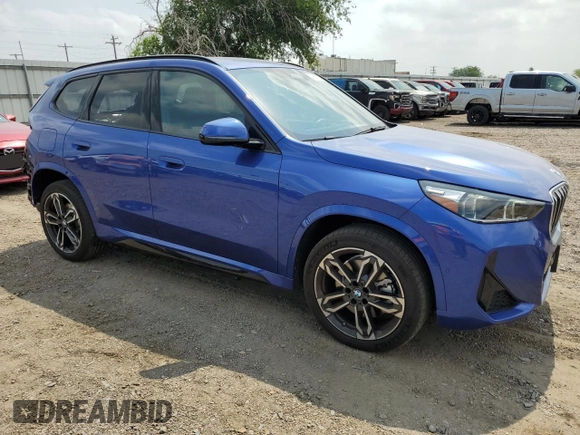 2024 BMW X1 xDrive28i with VIN WBX73EF06R5007063, listed as a Copart auction lot 56143075 with 2,947 mi miles and Salvage title. Bid and sale history available at DreamBid. Image 4.