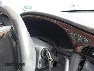 2004 Cadillac DeVille DHS z VIN 1G6KE57Y74U119605, wystawiony jako IAAI lot #40555057 z przebiegiem Nie podano mil oraz . Historia ofert i sprzedaży dostępna na DreamBid. Obrazek 15.