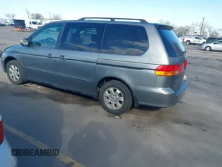 2002 Honda Odyssey EX z VIN 5FNRL186X2B014652, wystawiony jako IAAI lot #41950225 z przebiegiem 286 959 mil mil oraz . Historia ofert i sprzedaży dostępna na DreamBid. Obrazek 3.