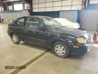 2005 Hyundai Accent GLS with VIN KMHCG35C95U327960, listed as a Copart auction lot 77151314 with 101,556 mi miles and Clean Title. Bid and sale history available at carsss.com. Image 4.
