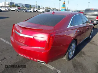 2013 Cadillac XTS Luxury with VIN 2G61P5S3XD9115546, listed as a IAAI auction lot 41980135 with 104,609 mi miles and . Bid and sale history available at DreamBid. Image 4.
