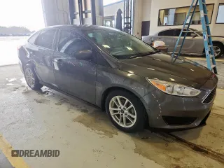 2018 Ford Focus SE with VIN 1FADP3FE0JL311760, listed as a Copart auction lot 63621755 with 81,000 mi miles and Salvage title. Bid and sale history available at DreamBid. Image 4.