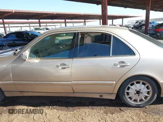 2001 Mercedes-Benz E-Class with VIN WDBJF65J11B232599, listed as a IAAI auction lot 41517879 with 173,366 mi miles. Bid and sale history available at carsss.com. Image 14.