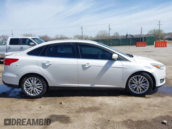 2015 Ford Focus Titanium с VIN 1FADP3J27FL341102, выставлен на аукционе IAAI как лот 41793450 с пробегом 96 465 миль миль и . История ставок и продаж доступна на DreamBid. Изображение 13.