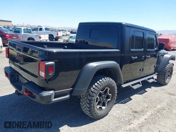2023 Jeep Gladiator Rubicon z VIN 1C6JJTBG3PL531982, wystawiony jako IAAI lot #42211139 z przebiegiem 28 301 mil mil oraz . Historia ofert i sprzedaży dostępna na DreamBid. Obrazek 4.