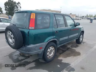 1999 Honda CR-V LX with VIN JHLRD284XXC002638, listed as a IAAI auction lot 42110994 with 164,706 mi miles. Bid and sale history available at carsss.com. Image 4.
