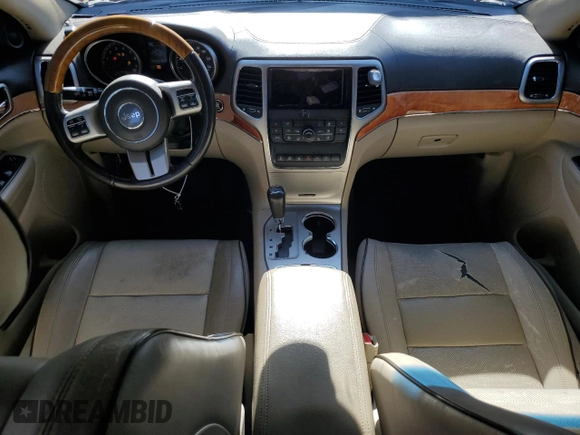 2011 Jeep Grand Cherokee Overland with VIN 1J4RR6GT8BC606688, listed as a Copart auction lot 57182295 with 100,423 mi miles and Salvage title. Bid and sale history available at DreamBid. Image 8.