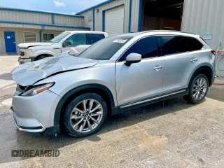 2021 Mazda CX-9 Grand Touring z VIN JM3TCADY6M0501370, wystawiony jako Copart lot #57895154 z przebiegiem 19 726 mil mil oraz Szkoda całkowita • Salvage title. Historia ofert i sprzedaży dostępna na DreamBid. Obrazek 1.