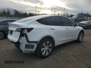 2023 Tesla Model Y Long Range with VIN 7SAYGDEE3PA130988, listed as a Copart auction lot 42172185 with 112,136 mi miles and Salvage Title. Bid and sale history available at DreamBid. Image 3.
