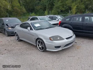 2005 Hyundai Tiburon GS with VIN KMHHM65D85U174335, listed as a IAAI auction lot 39373771 with 117,296 mi miles. Bid and sale history available at carsss.com. Image 1.