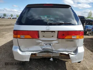 2002 Honda Odyssey EX z VIN 2HKRL186X2H006763, wystawiony jako Copart lot #57317075 z przebiegiem 282 090 mil mil oraz Szkoda całkowita • Salvage title. Historia ofert i sprzedaży dostępna na DreamBid. Obrazek 6.