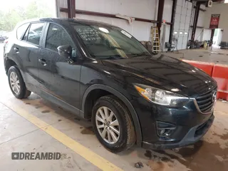 2016 Mazda CX-5 Touring with VIN JM3KE2CY7G0867355, listed as a IAAI auction lot 41963169 with 117,727 mi miles and . Bid and sale history available at carsss.com. Image 1.