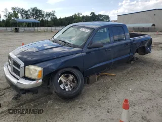 2005 Dodge Dakota SLT with VIN 1D7HE48NX5S308595, listed as a Copart auction lot 56713434 with 257,419 mi miles and Salvage Title. Bid and sale history available at carsss.com. Image 1.