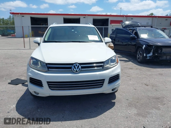 2012 Volkswagen Touareg Sport with VIN WVGEF9BP1CD008717, listed as a IAAI auction lot 42120641 with 211,580 mi miles and . Bid and sale history available at DreamBid. Image 12.