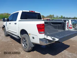 2014 Nissan Titan S with VIN 1N6AA0EC3EN502951, listed as a IAAI auction lot 41956309 with 128,464 mi miles and . Bid and sale history available at DreamBid. Image 3.
