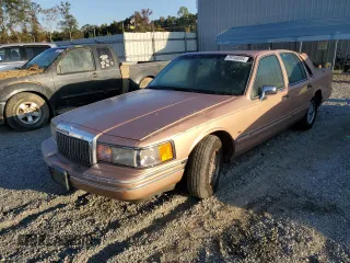 1994 Lincoln Town Car Executive with VIN 1LNLM81W5RY645644, listed as a Copart auction lot 74146694 with 177,184 mi miles and Salvage title. Bid and sale history available at DreamBid. Image 1.