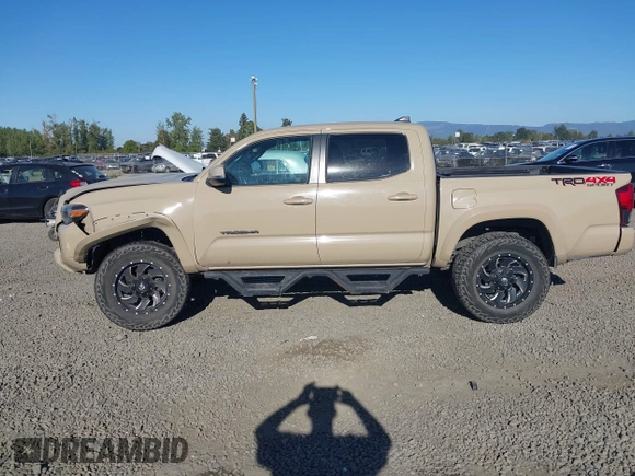 2018 Toyota Tacoma SR z VIN 3TMCZ5AN7JM125425, wystawiony jako IAAI lot #40459066 z przebiegiem 85 182 mil mil oraz . Historia ofert i sprzedaży dostępna na DreamBid. Obrazek 14.