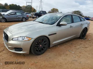 2014 Jaguar XJ with VIN SAJWA1CZ5E8V71971, listed as a Copart auction lot 82116114 with 127,164 mi miles and Salvage Title. Bid and sale history available at DreamBid. Image 1.